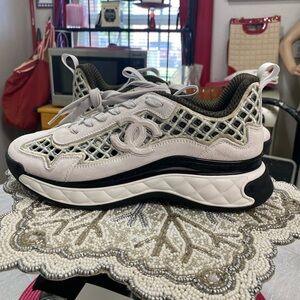 CHANEL
Interlocking CC Logo Suede Sneakers